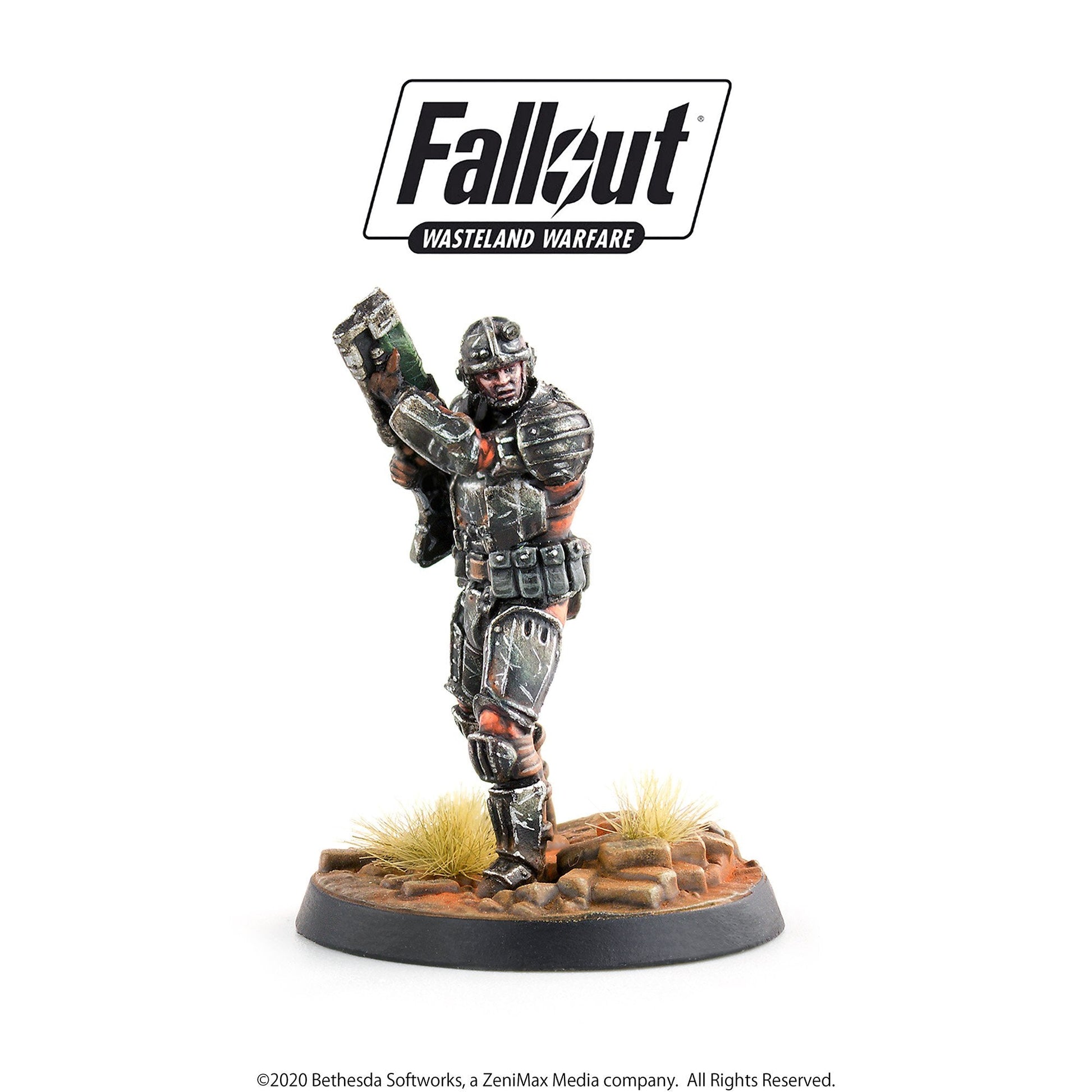 Fallout Wasteland Warfare miniature: A grim, armored soldier holds a large rifle in a combat pose on a desert base