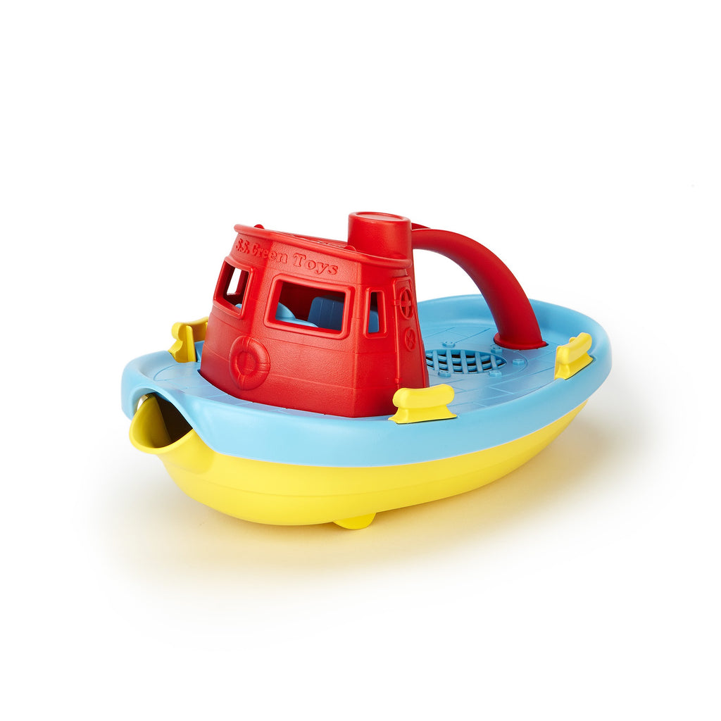 Plastic toy tugboat in yellow, blue, and red with a red handle and pouring spout