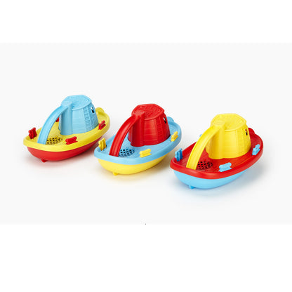 Three multicoloured plastic bath toy boats (red, yellow, and blue) on a white surface