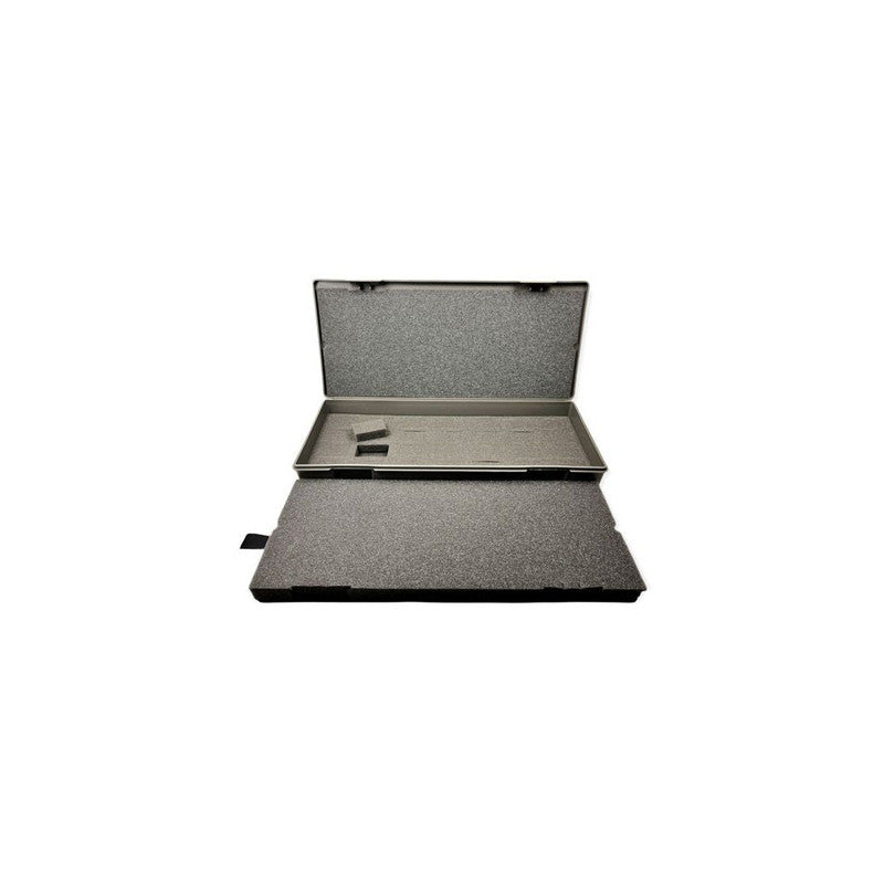 Open dark grey hard case with dense grey foam interior