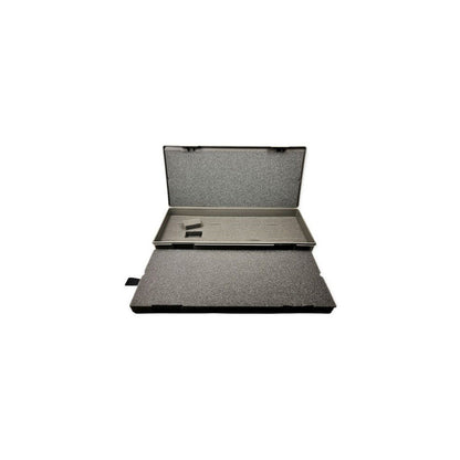 Open dark grey hard case with dense grey foam interior