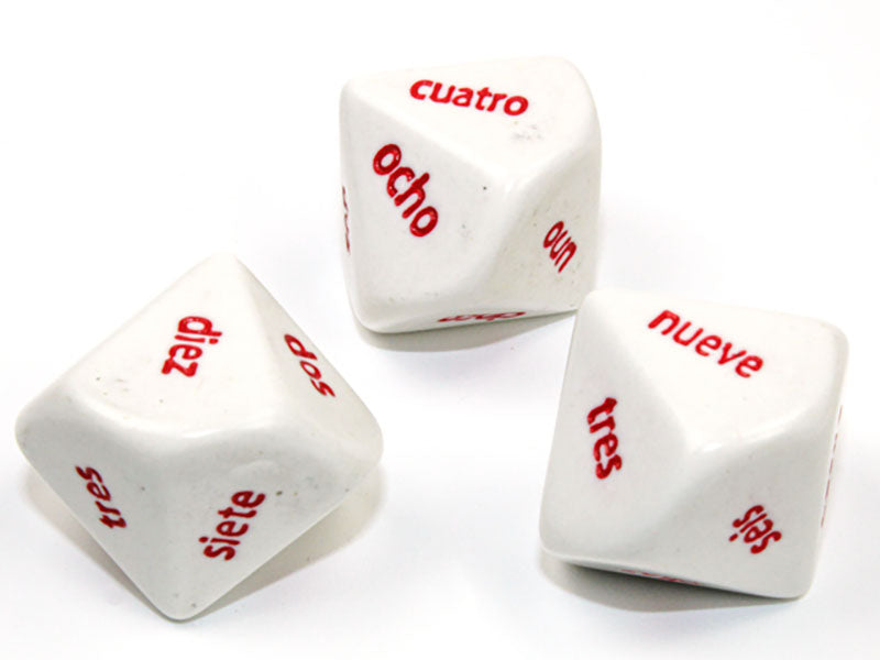 Three white 10 sided dice with red Spanish Word Numbers showing on a white background