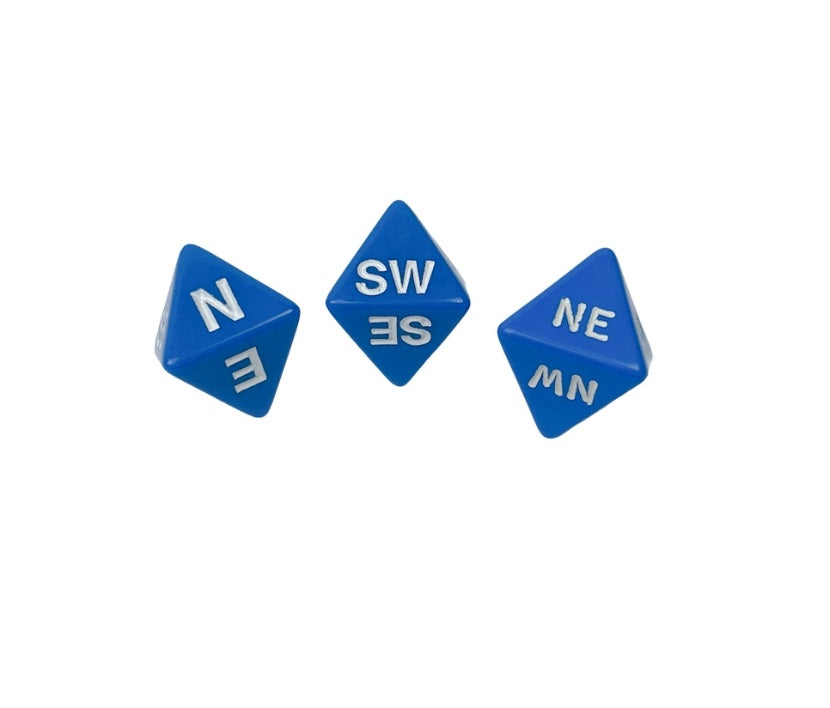 Three blue d8 dice with white compass directions scattered