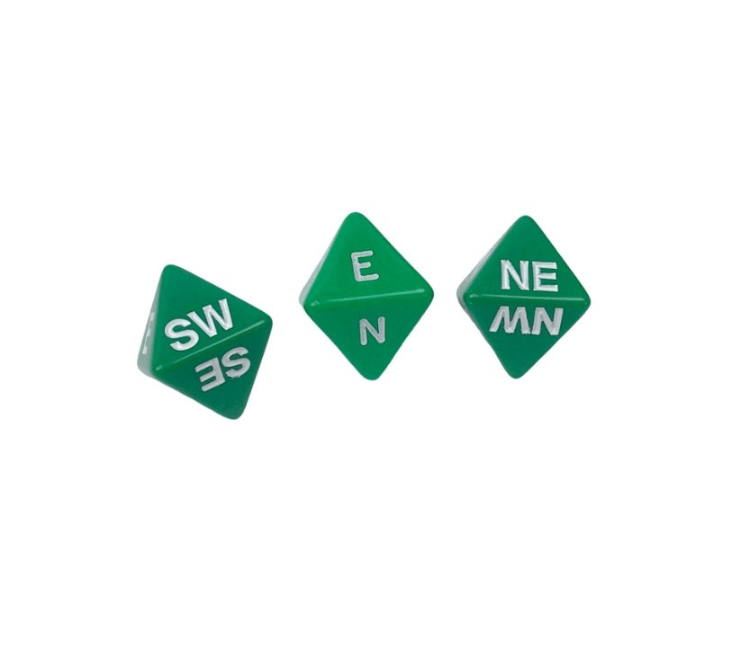 Three green d8 dice with white compass directions scattered