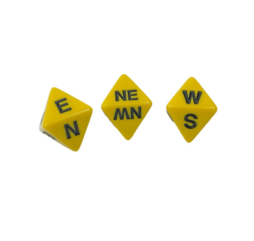 Three yellow d8 dice with white compass directions scattered