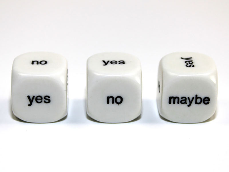Three white 6 sided dice with black Yes No Maybe showing on a white background