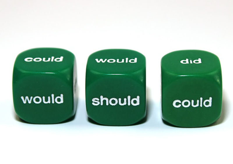 Three green 6 sided dice with white Helping Verbs words showing on a white background