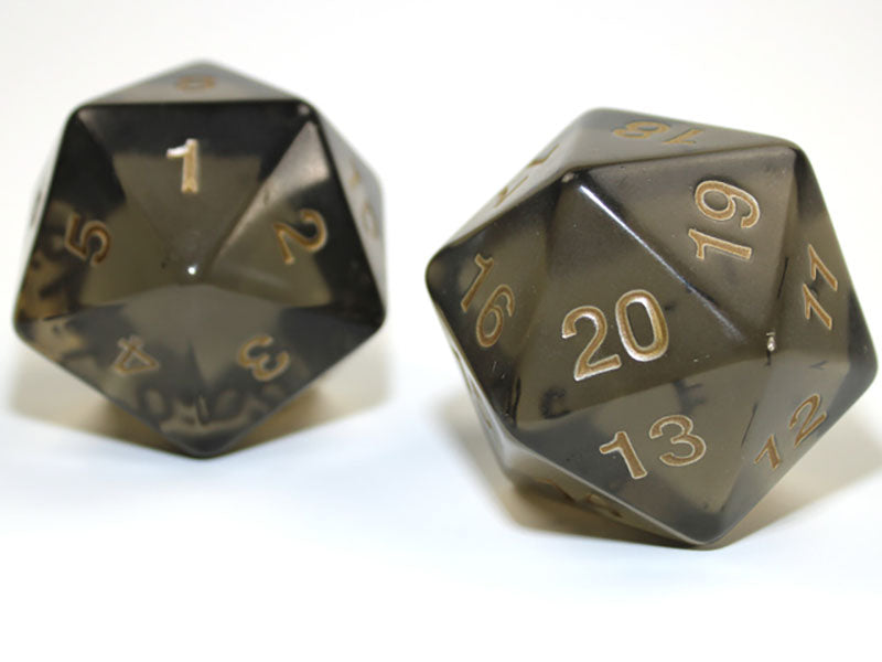 Two translucent smoke 20 sided dice with gold 1 20 numbers showing on a white background
