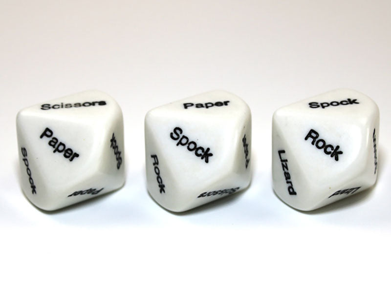Three white dice displaying "Rock Paper Scissors Lizard Spock" game words in black text on a white surface 