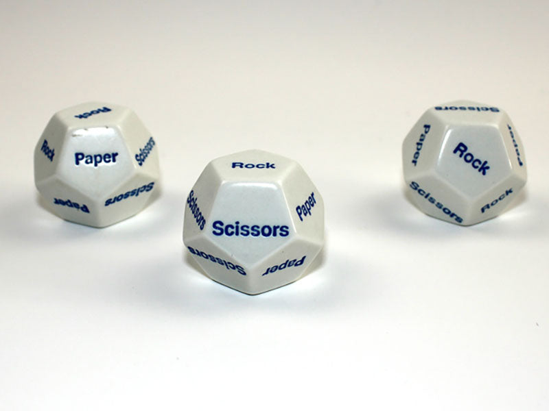 Three white 12 sided dice with blue Rock Paper Scissors showing on a white background