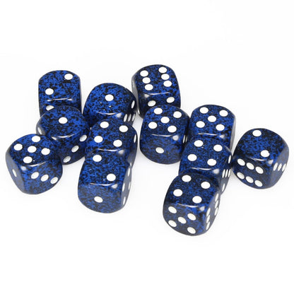 Twelve Chessex 16mm D6 Speckled Stealth dice are scattered on a white background, displaying their dark blue bodies with black flecks and white pips
