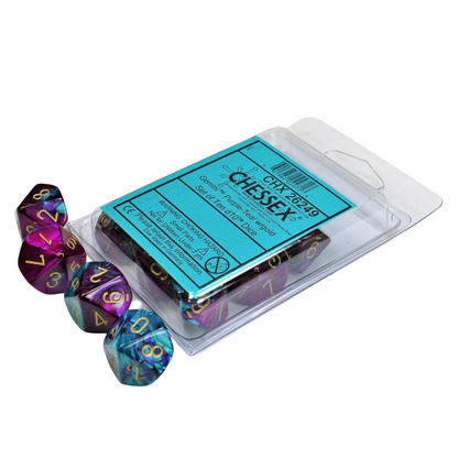 A set of ten Gemini d10 dice in purple and teal with gold numbers, in clear plastic packaging, with three dice loose