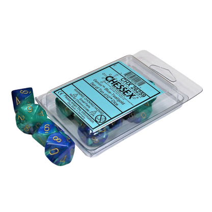 A clear package holds a Gemini d10 Dice 10-piece set in blue and teal with gold numbers, with several matching dice loose beside it