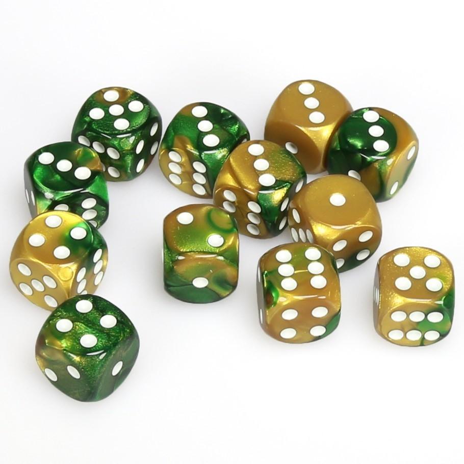 A dozen Chessex Gemini 16mm D6 dice, distinctively swirled in gold and green with contrasting white pips, are casually scattered on a clean white surface