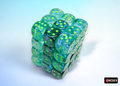 Cube of translucent green Chessex dice with bright green pips, on a light blue and white background