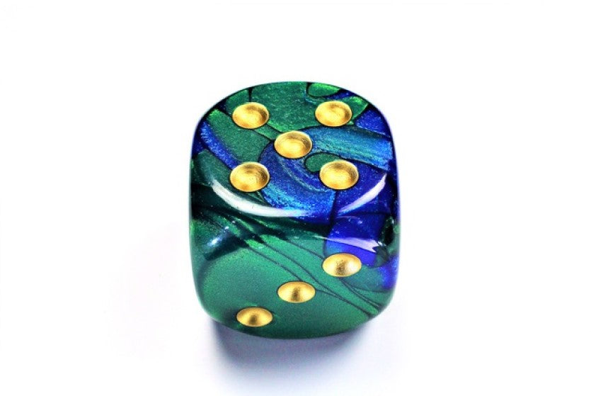 Blue and Green and Gold die showing 5 and 3 faces with gold pips visible, on a white background