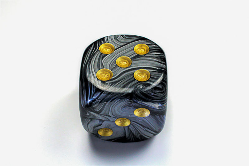 Black and Gold die showing 5 and 3 faces with gold pips visible, on a white background