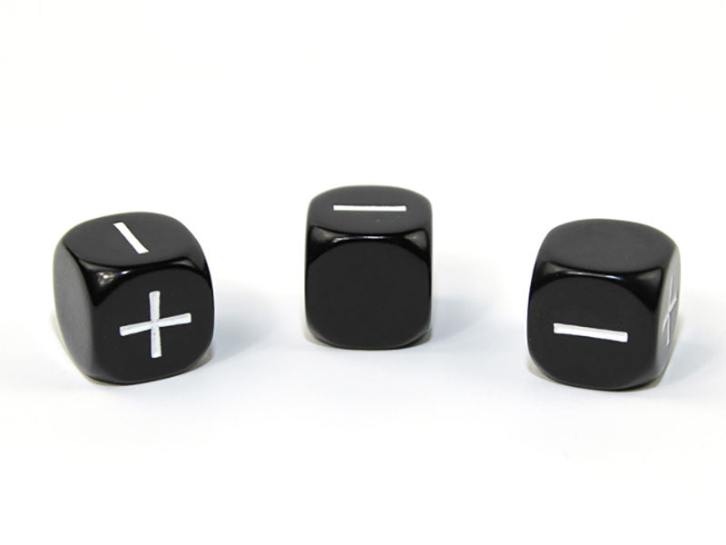 Black die showing + and - faces on a white background