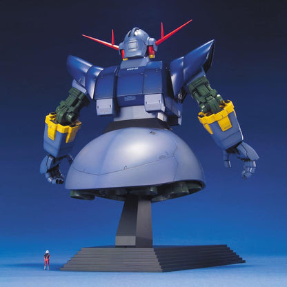 Giant blue MSN-02 Zeong mobile suit model torso displayed on a pedestal next to a tiny human figure for scale