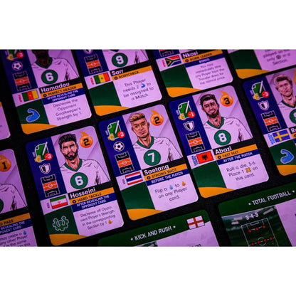 Close up view of multiple soccer trading cards showing players with stats and abilities