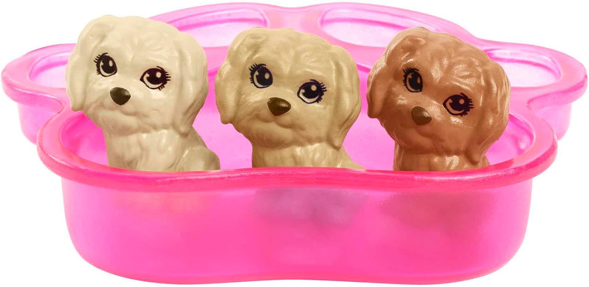 Three stylized puppiesâ€”cream, tan, and brownâ€”sit in a bright pink paw-print bath tub