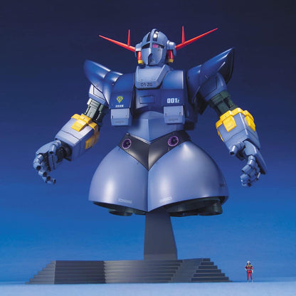 A massive, legless, dark blue Zeong mobile suit model on a stand, with a tiny human figure at the base for scale