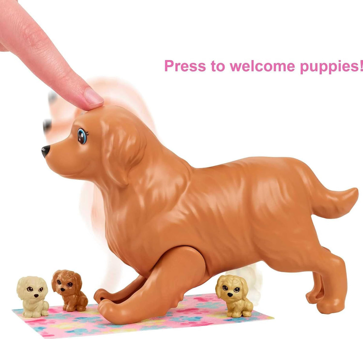 A human finger presses the head of a brown toy dog, demonstrating its feature of &quot;welcoming&quot; three small puppies around it