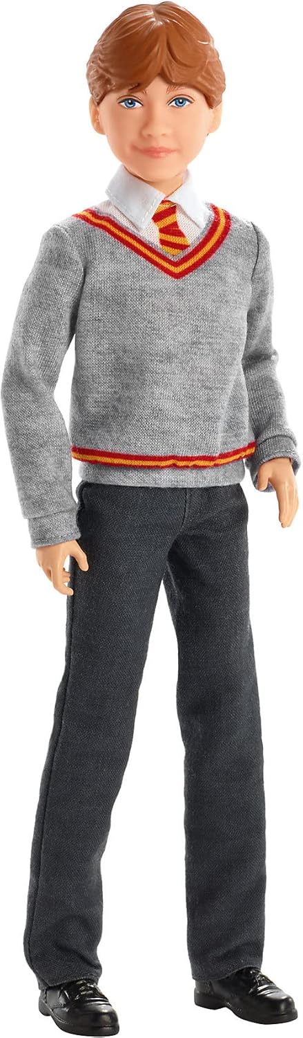 Ron Weasley doll standing in a grey Gryffindor uniform sweater, white shirt, striped tie, dark pants, and black shoes