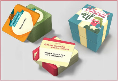 Three stacks of colorful game cards and a "Weird Little Elf" gift-box style game package with elf-themed questions visible
