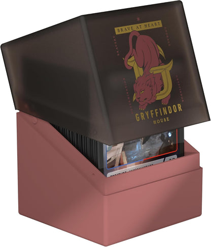 Open rose-colored deck box for trading cards. Lid features the Gryffindor lion crest and house name