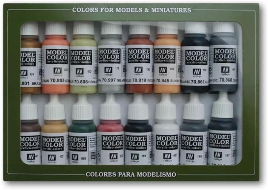 A green box holds 16 small bottles of multi-colored Vallejo Model Color acrylic paints for models and miniatures