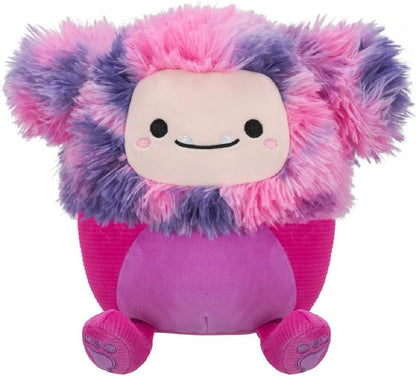 Fuzzy pink and purple monster plush with a soft face, fangs, and magenta body, isolated on white