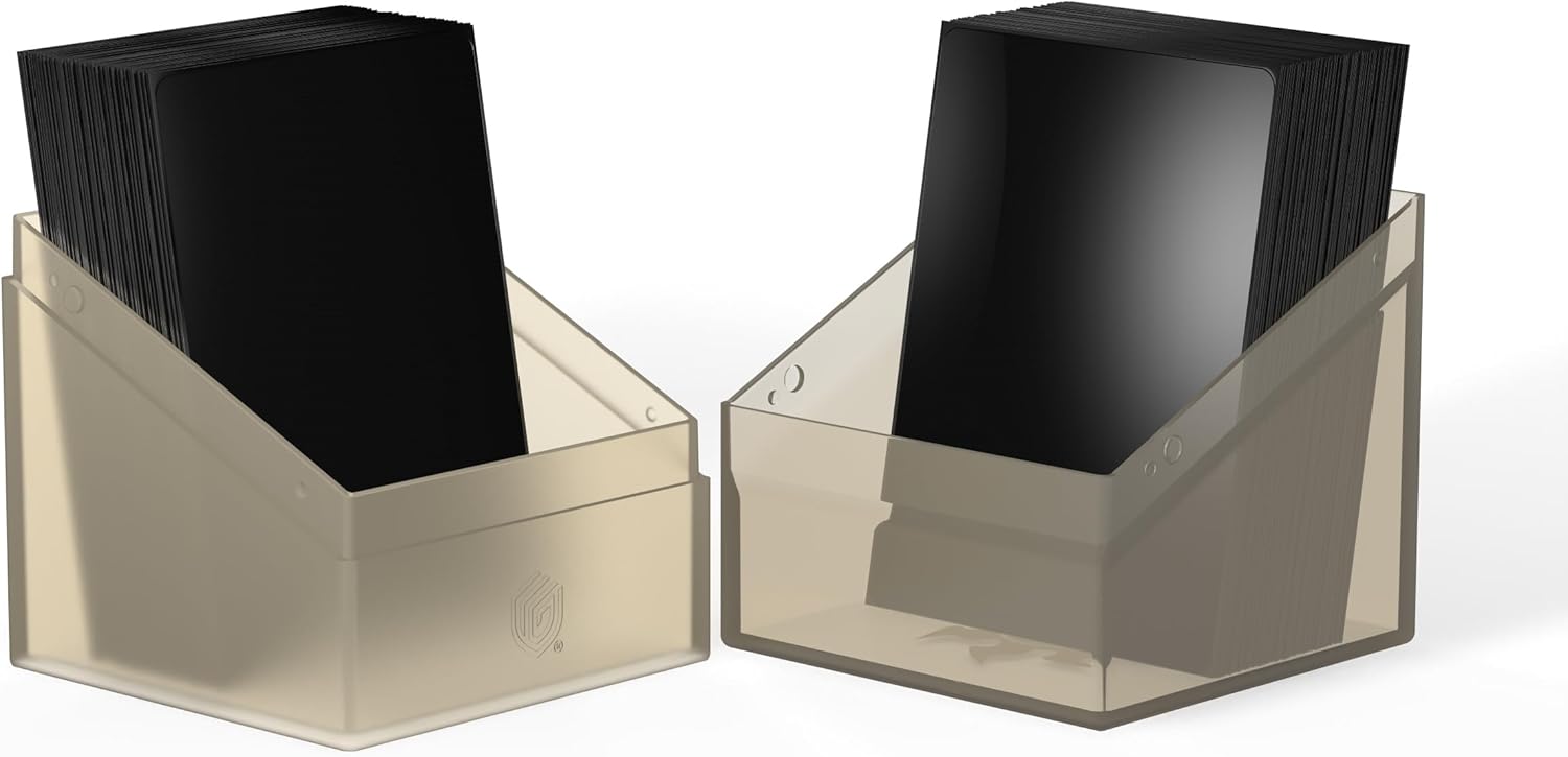 Two translucent deck boxes filled with stacks of black gaming card sleeves