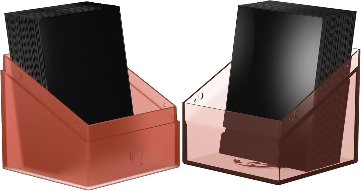 Pair of translucent copper deck boxes filled with stacks of black-sleeved trading cards
