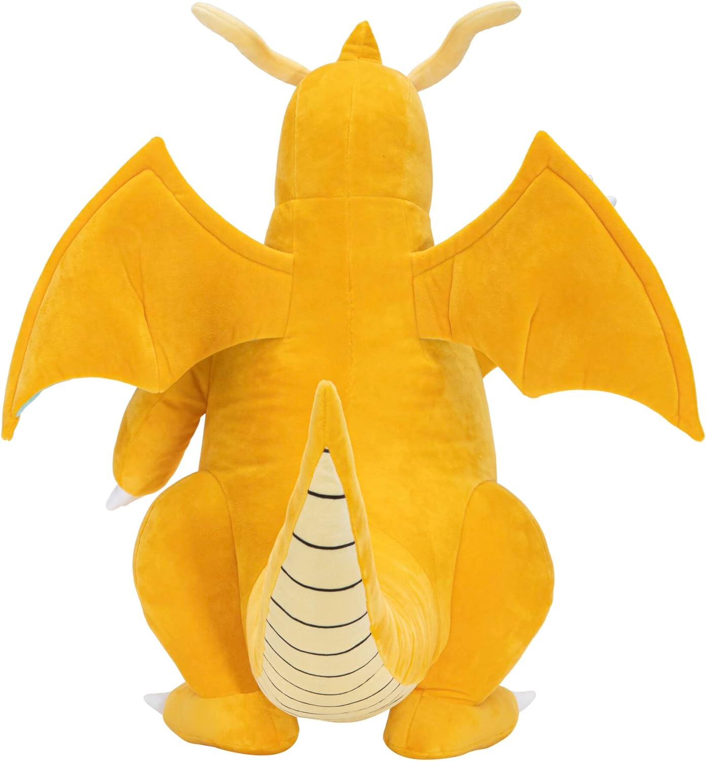 Large yellow Dragonite plush toy seen from the back, emphasizing wings and segmented tail