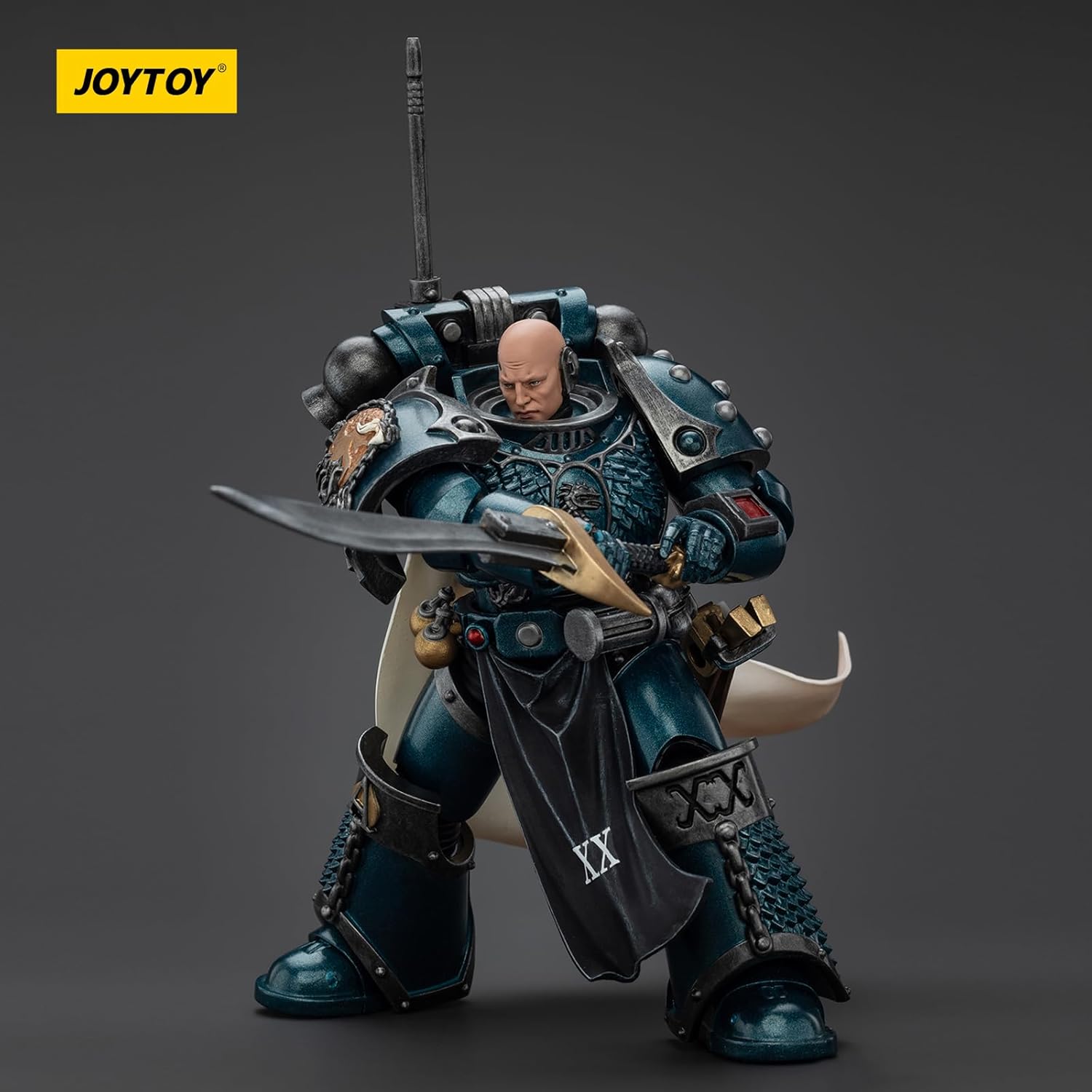 A Joytoy Alpha Legion Space Marine action figure, bald and in dark teal armor, holding a large ornate sword in a ready pose