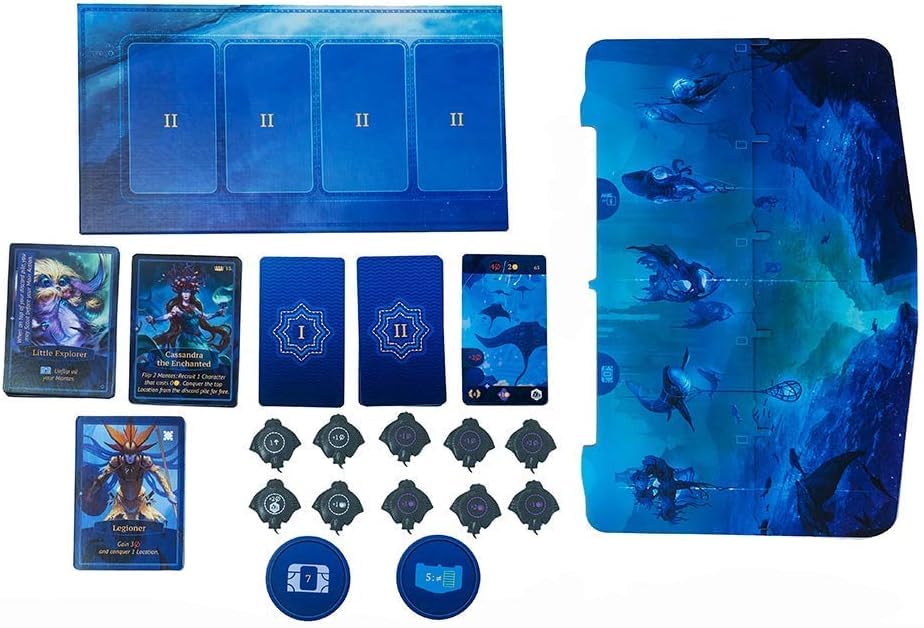 A deep-sea themed board game set featuring multiple blue boards, character cards, and circular and stingray-shaped tokens