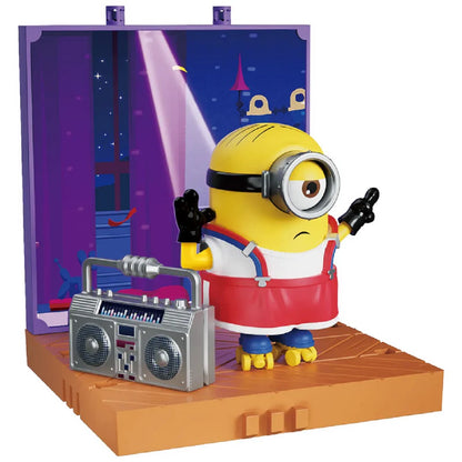 Minion figure on roller skates, posing dramatically next to a silver boombox on a stage set