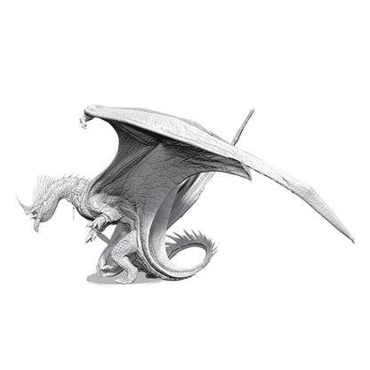 An unpainted Ancient Blue Dragon miniature features large extended wings, textured scales, and a curled tail ready for battle
