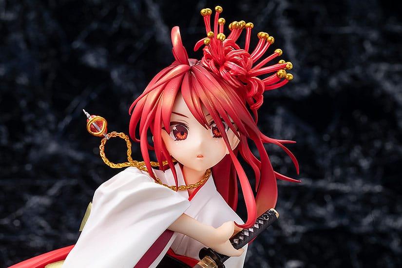 Detailed close-up of a red-haired anime figure in a white kimono holding a small sword