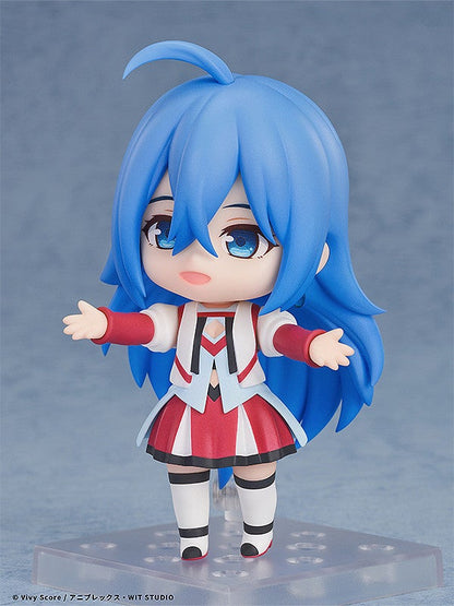 Anime figure of Vivy with blue hair and red and white outfit standing on a clear base