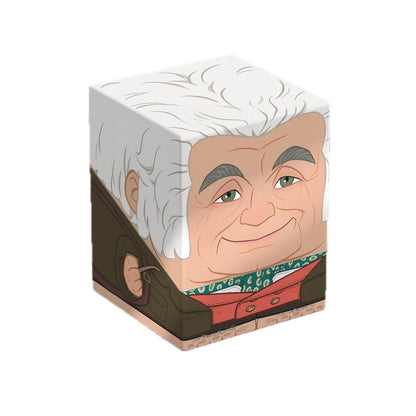 Cube figure of a smiling older man with white hair, wearing a brown jacket and red vest