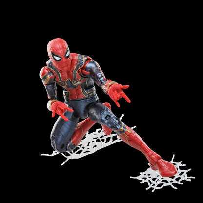 A Spider-Man Iron Spider Action Figure is posed crouching on white web details against a black background