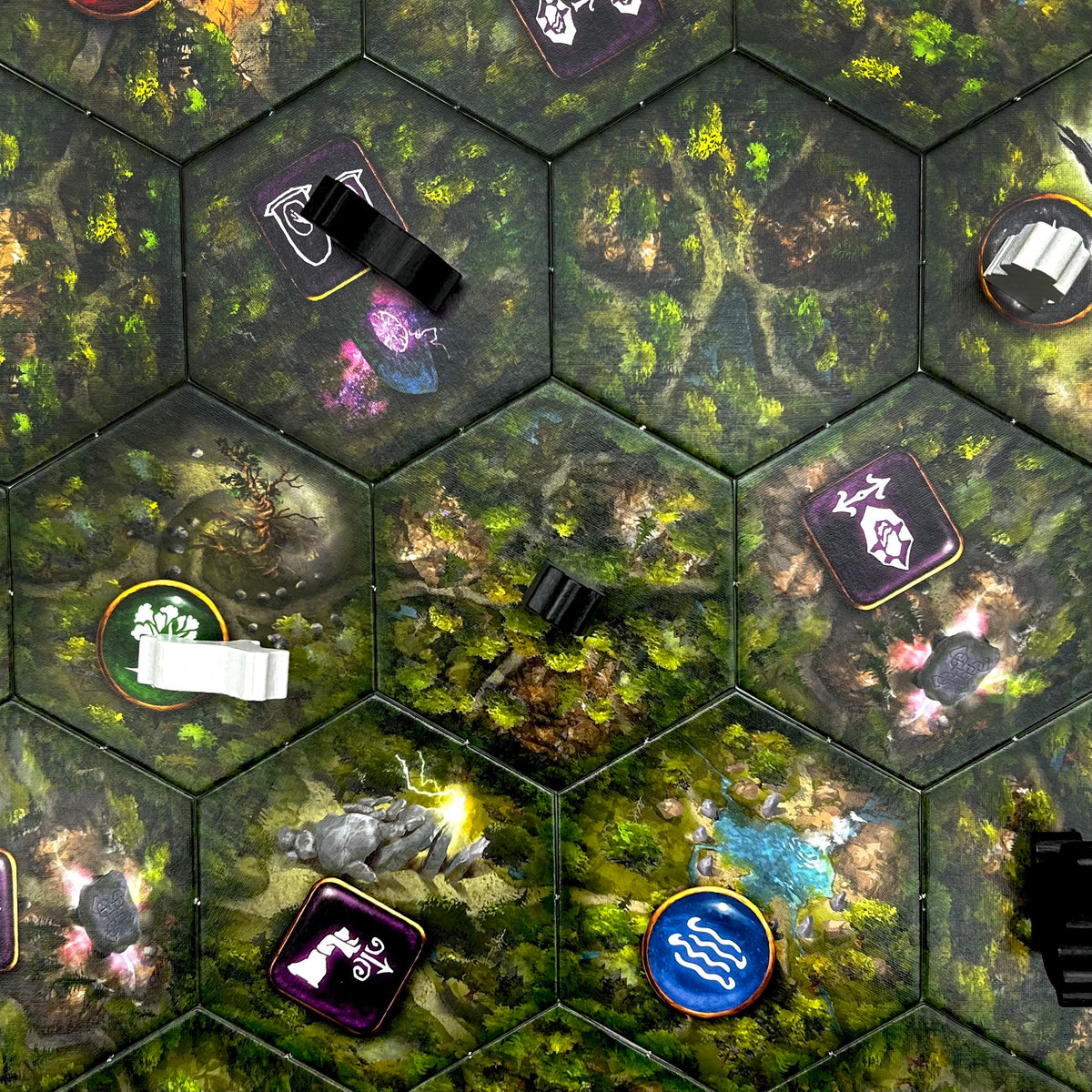 Close-up of tokens and components from Druids of the Elements