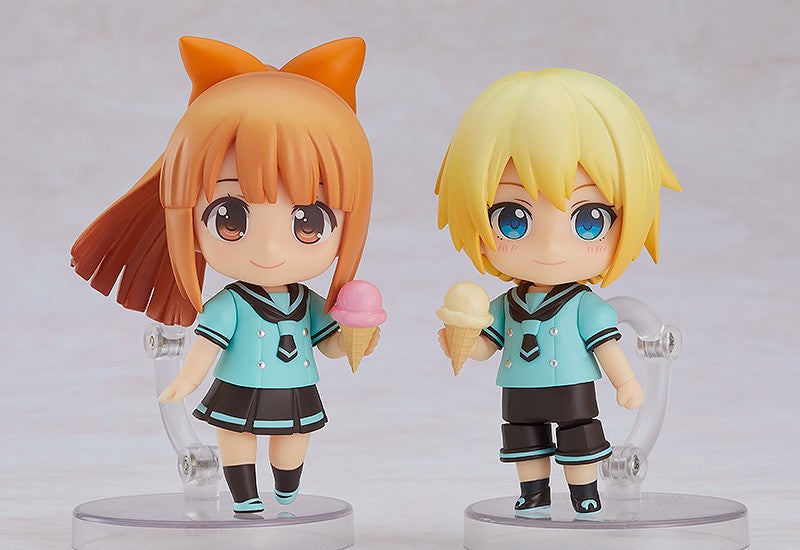 Side view of Nendoroid figures interacting in the shop display