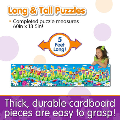 Young girl pointing at a completed 5-foot-long alphabet caterpillar floor puzzle