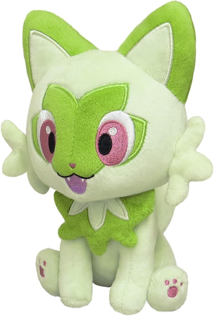 Sitting green Pokémon Sprigatito plush with pink eyes and tongue sticking out