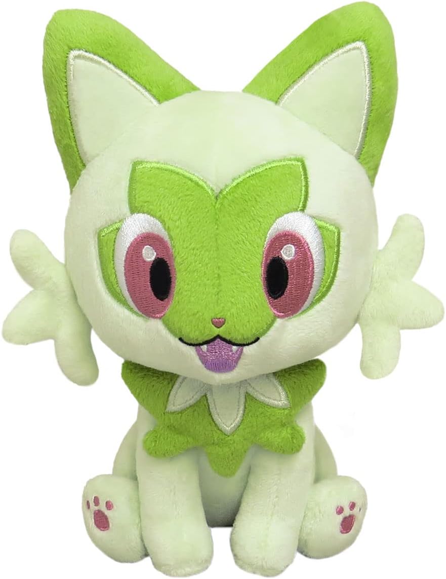 Pokémon Sprigatito plush toy sitting, featuring green fur, pink eyes, and a tongue sticking out