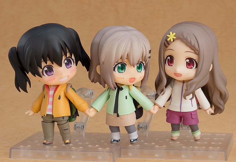 Full display of Nendoroid Kokona Aoba with all optional face plates, arms, and camping gear