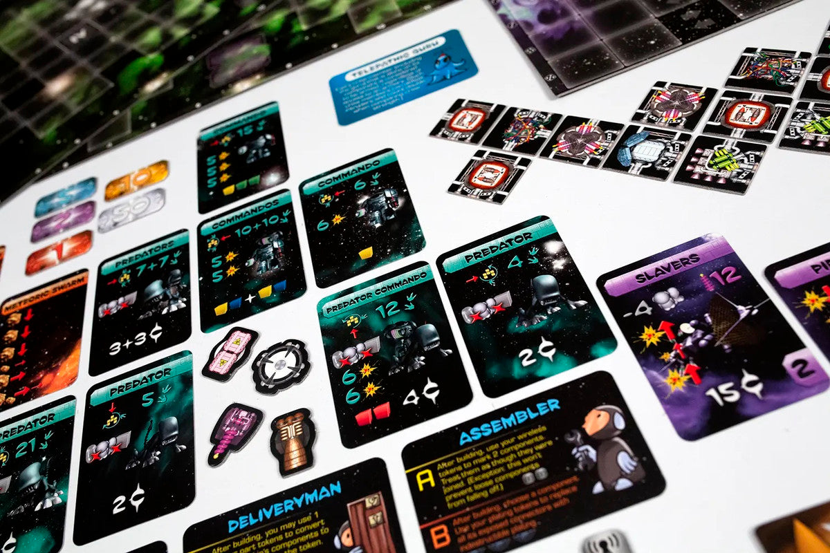 A close-up of numerous colorful sci-fi board game cards, tokens, and a galactic game board laid out
